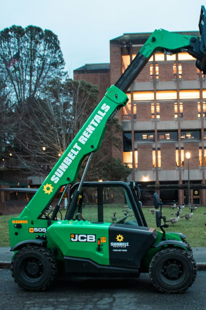 A green and black JCB telehandler.